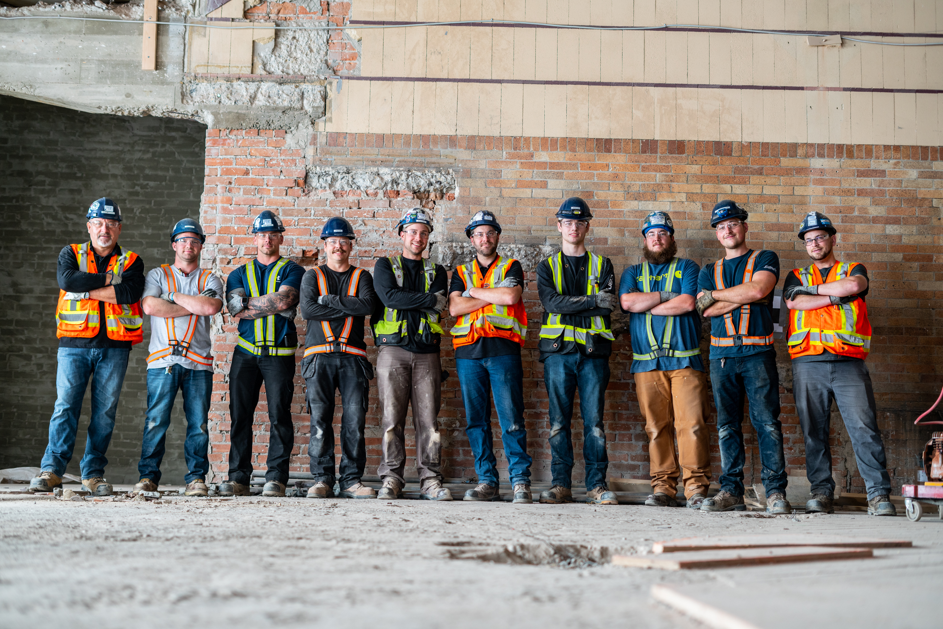 Construction workers posing together for a picture.